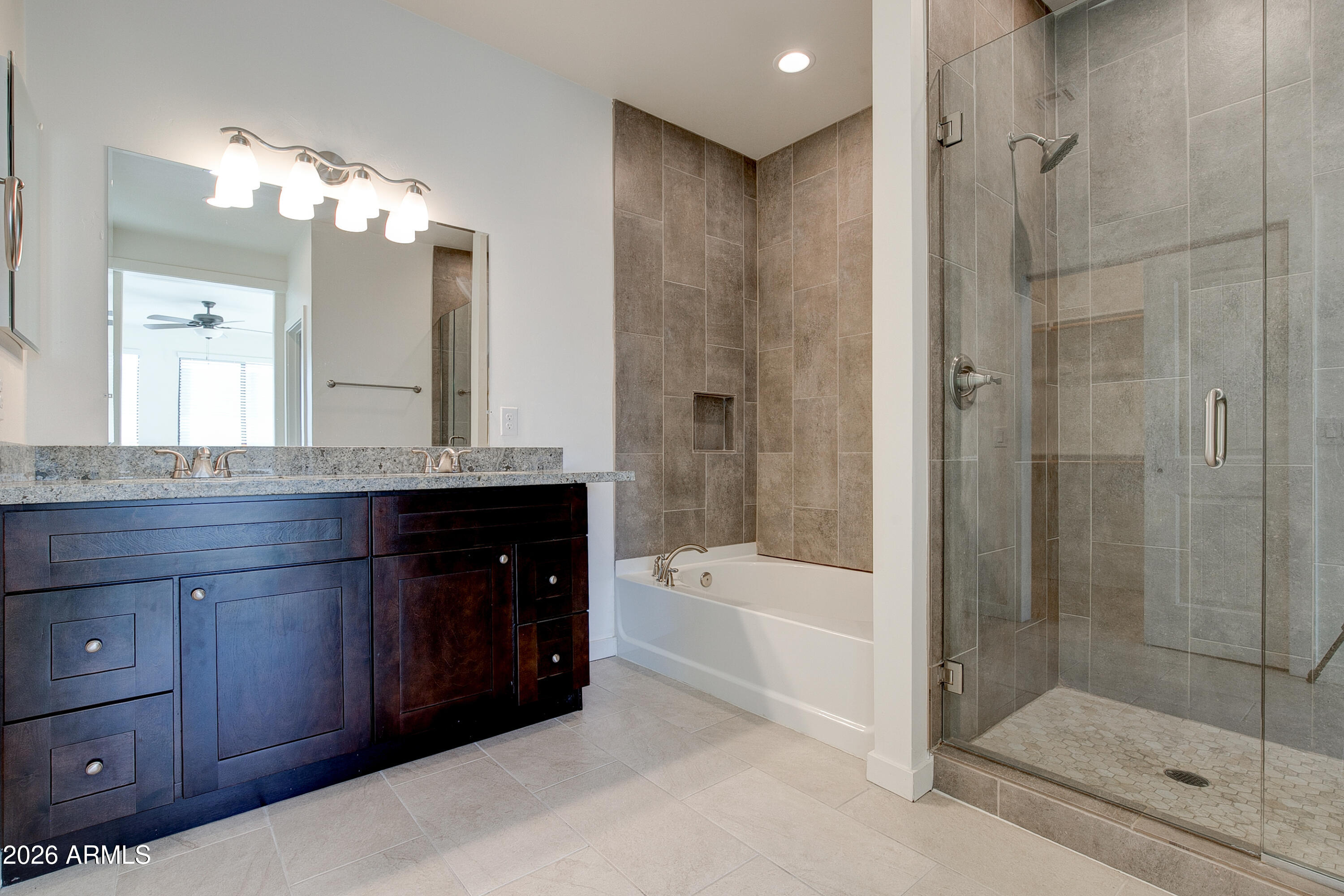 16075 North 30th Street Phoenix, AZ 85032 - Photo 23 of 41 a bathroom with a bathtub shower sink mirror and