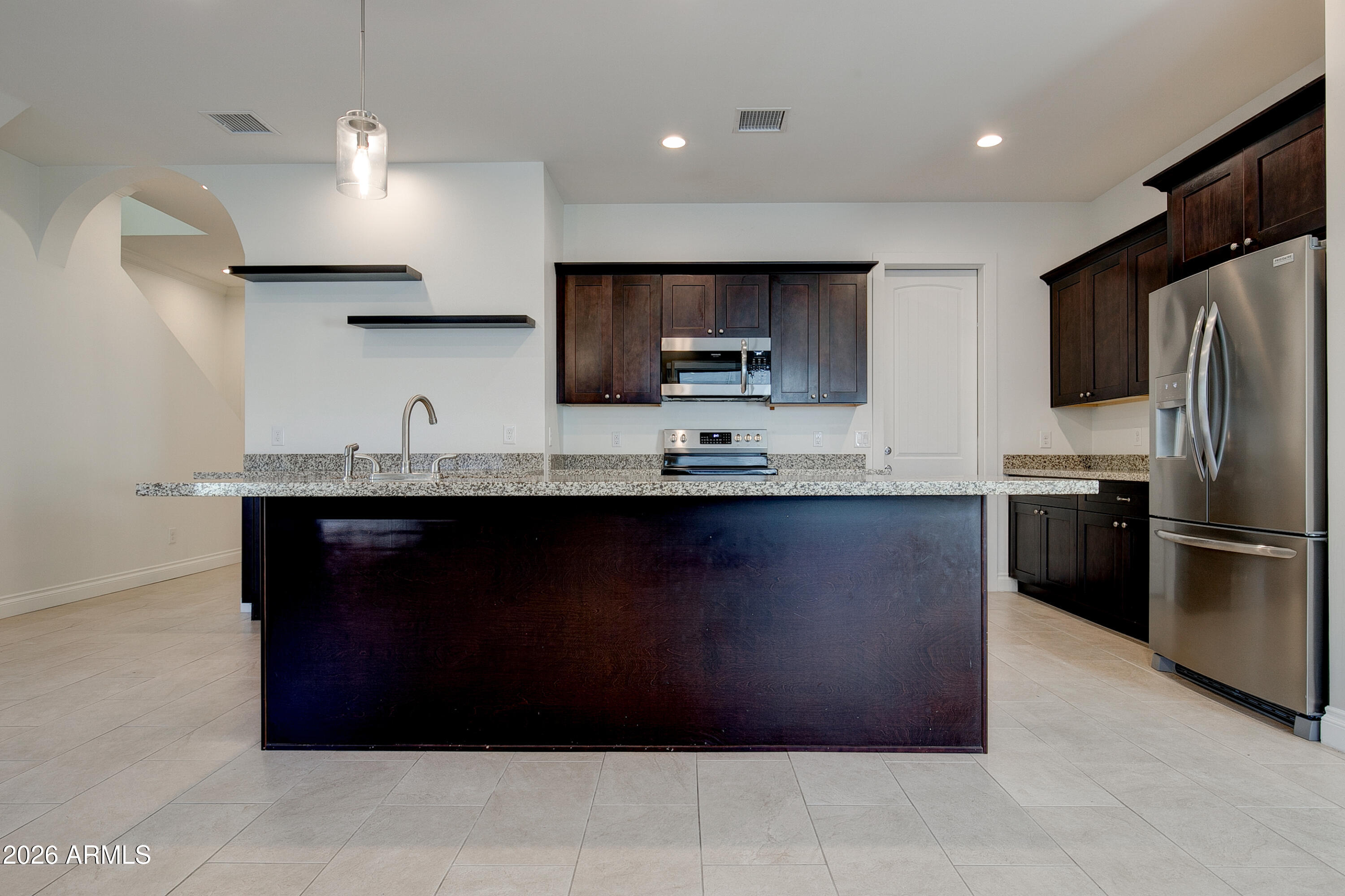 16075 North 30th Street Phoenix, AZ 85032 - Photo 10 of 41 a kitchen with a sink a refrigerator and a stove