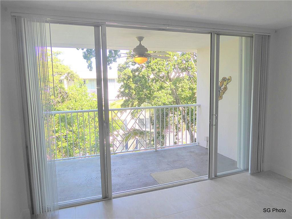 611 East Woolbright Road, Unit 407 Boynton Beach, FL 33435 - Photo 6 of 22 a view of a room with a large window