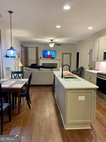 a kitchen with a sink stove and refrigerator