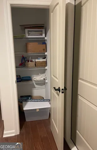 a living room with stainless steel appliances furniture stove top oven and kitchen view