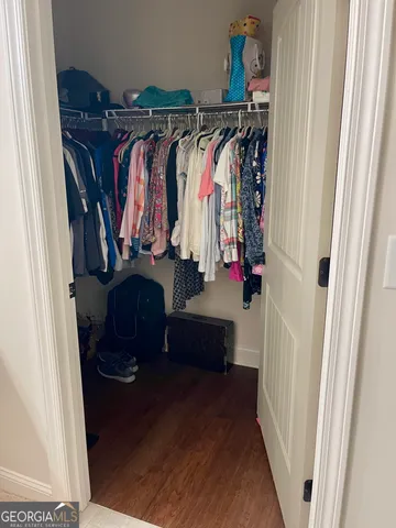 a bathroom with a toilet and a mirror