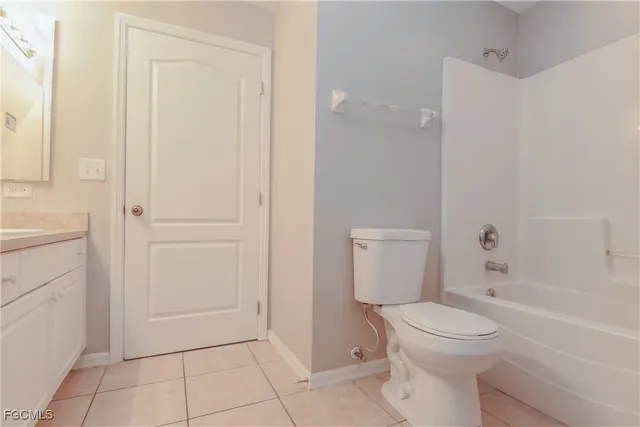 a bathroom with a toilet a sink and bathtub