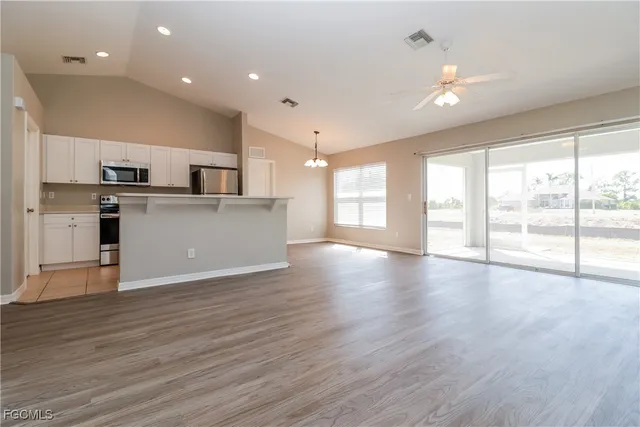 a view of kitchen with stainless steel appliances refrigerator oven and stove