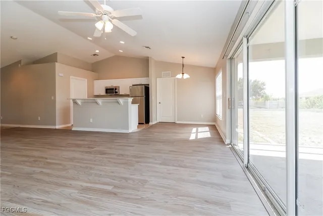 a view of a kitchen with a sink and a window