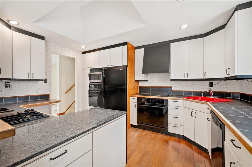 154 North Jamestown Road Coraopolis, PA 15108 - Photo 13 of 25 a kitchen with a sink stove and refrigerator