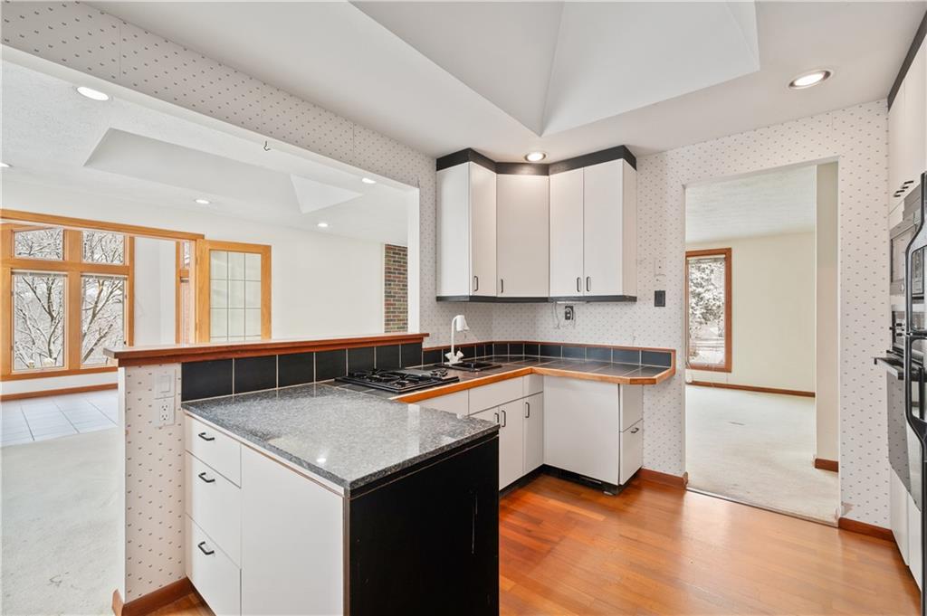 154 North Jamestown Road Coraopolis, PA 15108 - Photo 14 of 25 a kitchen with granite countertop white cabinets and white appliances