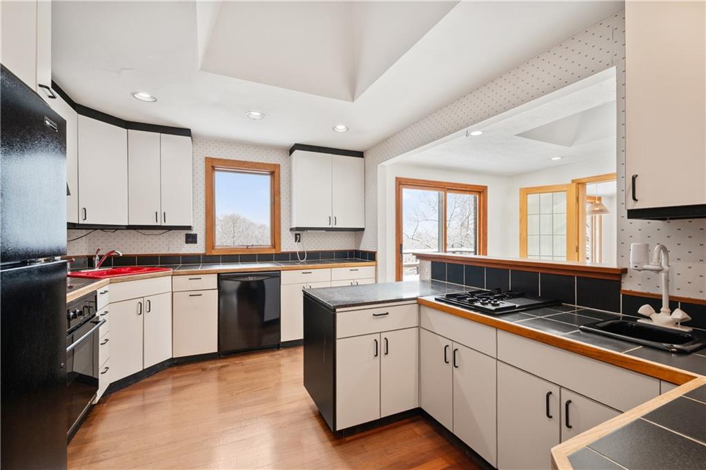154 North Jamestown Road Coraopolis, PA 15108 - Photo 15 of 25 a kitchen with a sink stove top oven and cabinets