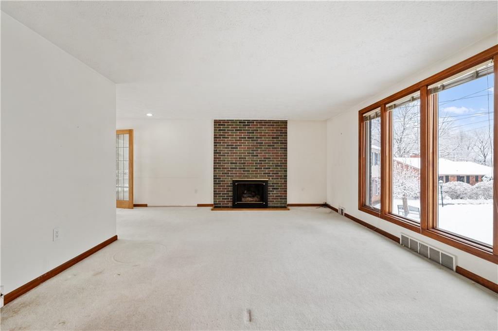 154 North Jamestown Road Coraopolis, PA 15108 - Photo 7 of 25 an empty room with windows and fireplace