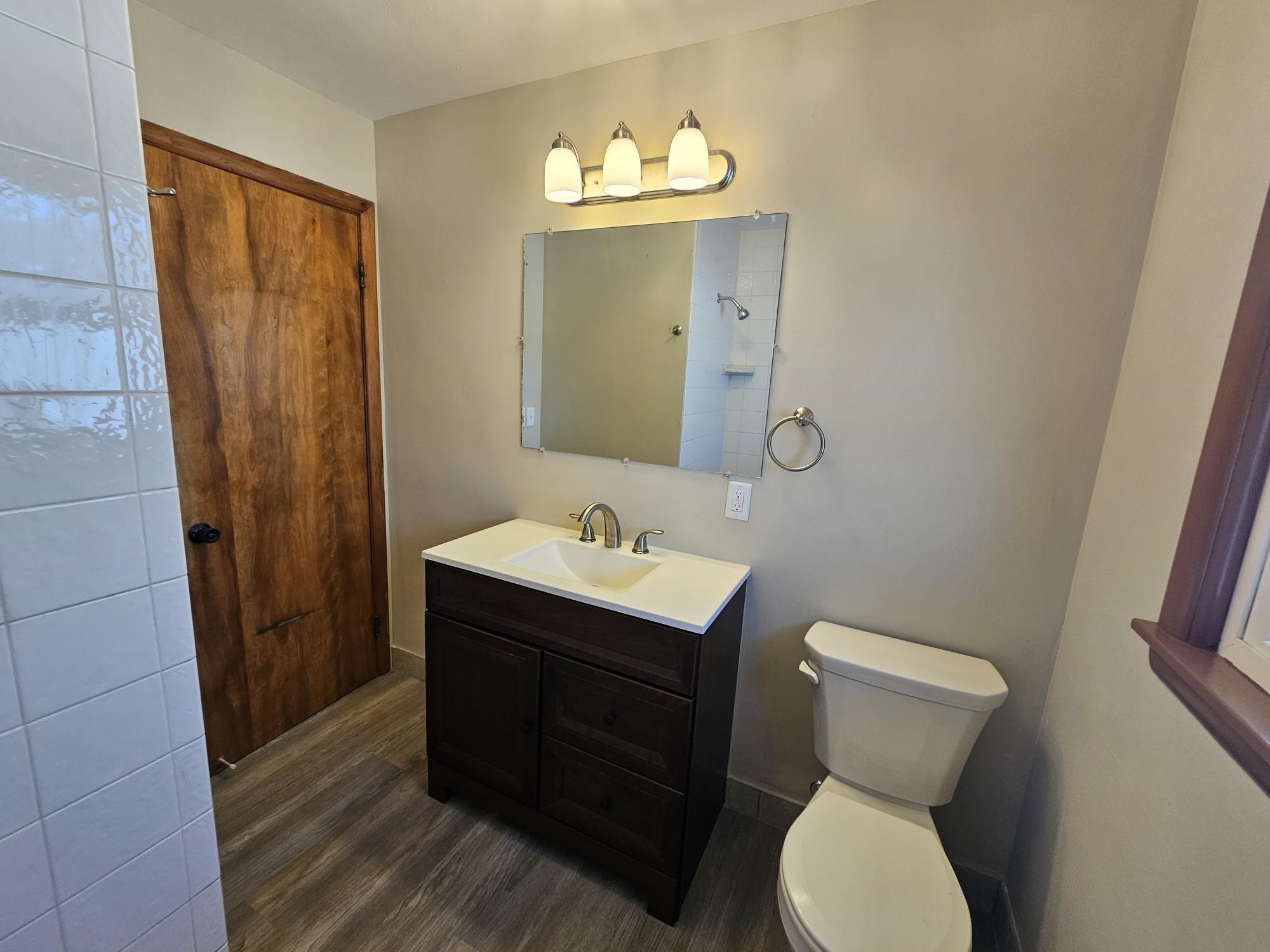 3612 Beach Street Rockford, IL 61108 - Photo 15 of 24 a bathroom with a sink and a mirror