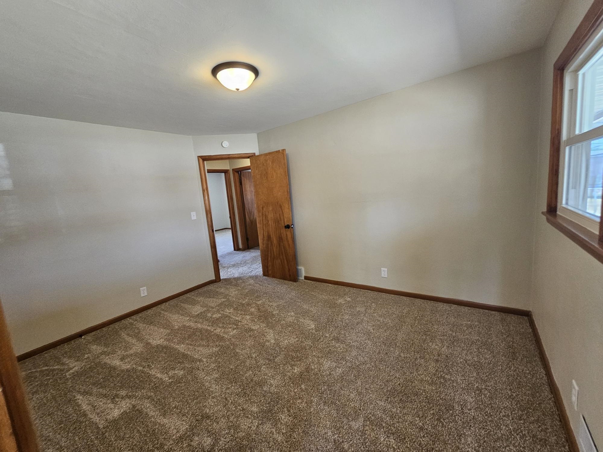 3612 Beach Street Rockford, IL 61108 - Photo 18 of 24 an empty room with windows and closet
