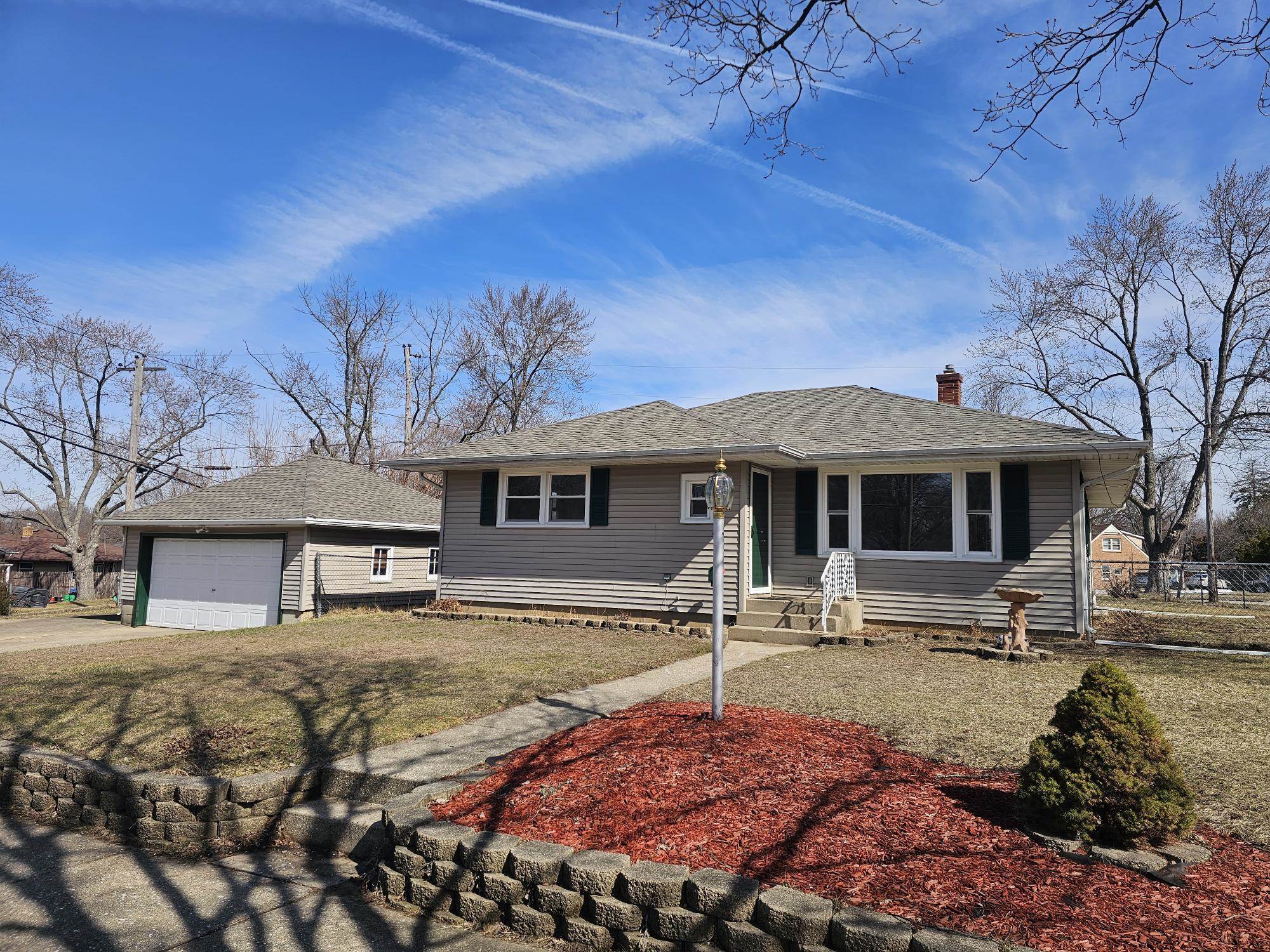 3612 Beach Street Rockford, IL 61108 - Photo 2 of 24 a front view of a house with garden
