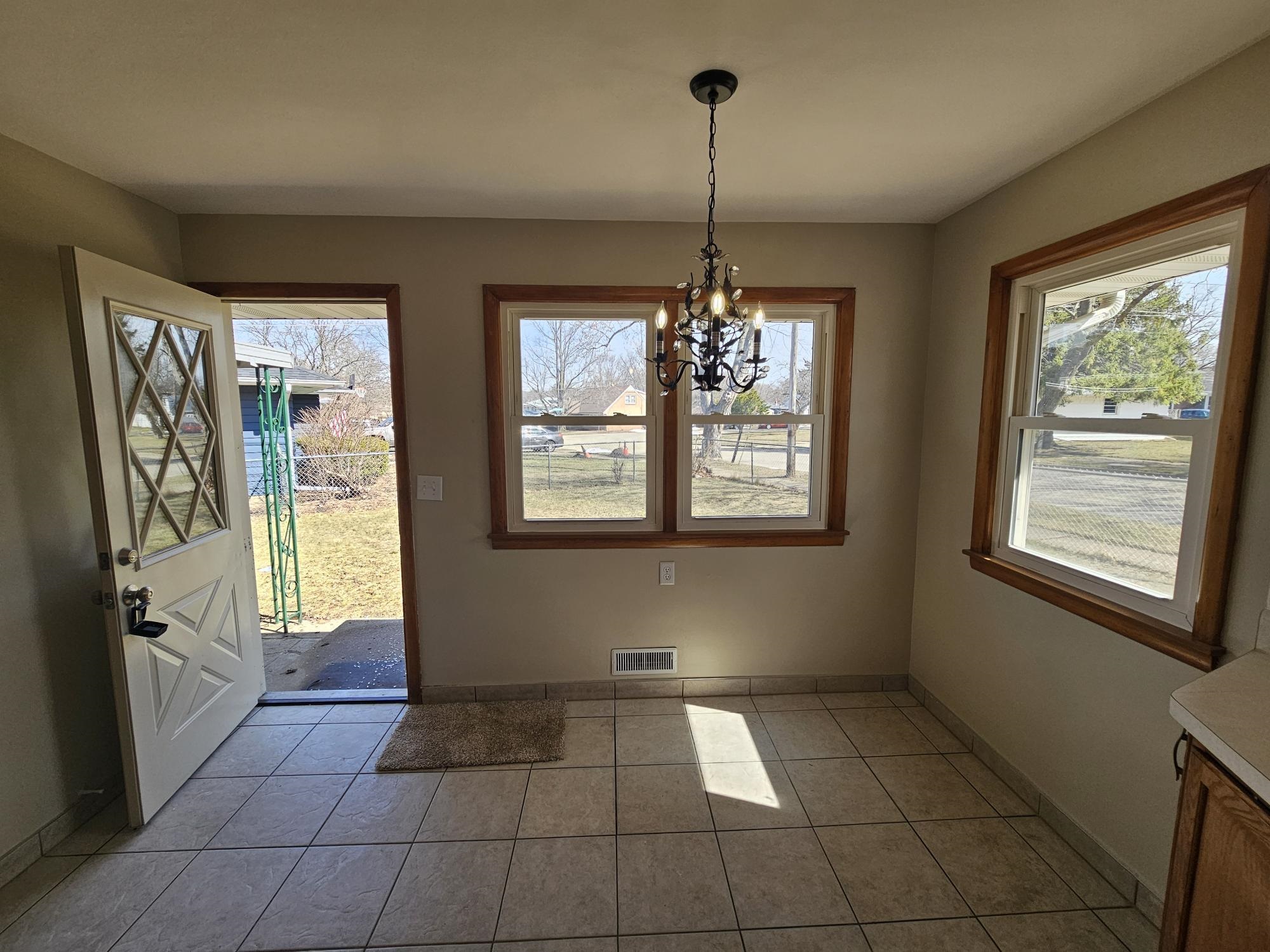 3612 Beach Street Rockford, IL 61108 - Photo 3 of 24 a view of an empty room with windows