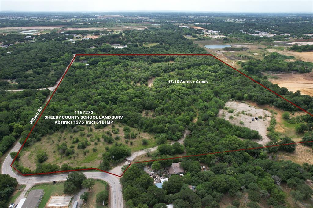 5570 Wilson Road Fort Worth, TX 76140 - Photo 1 of 2 an aerial view of residential houses with outdoor space and trees