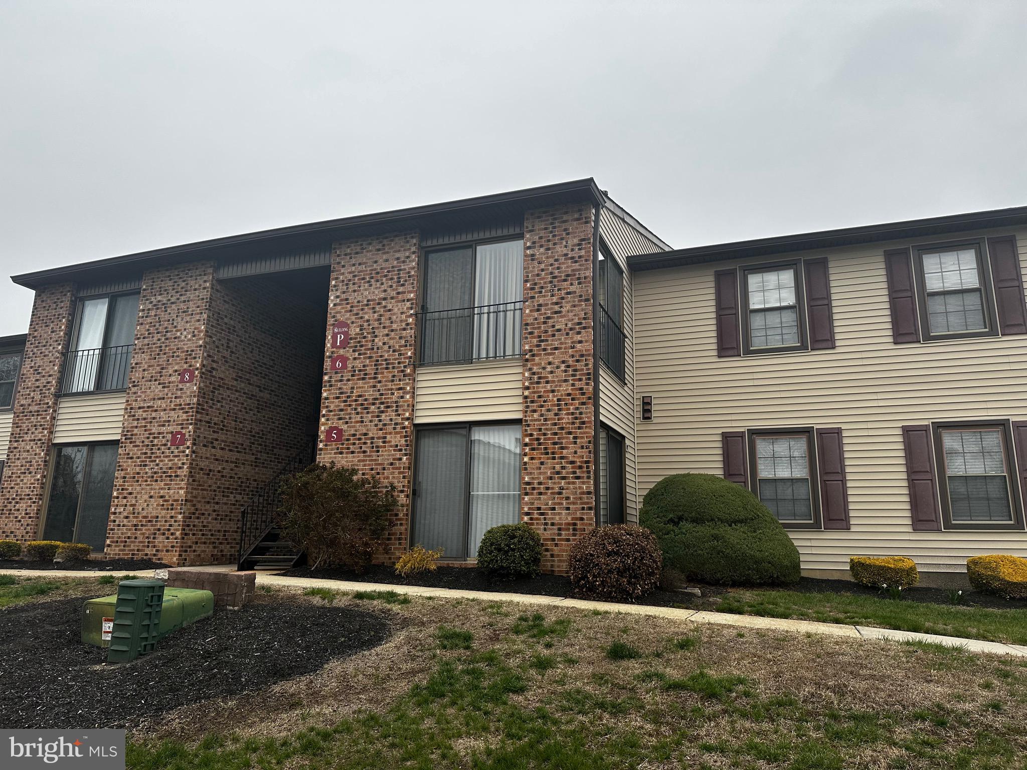 6 Kent Place Sewell, NJ 08080 - Photo 2 of 13 a brick house with a yard in front of it
