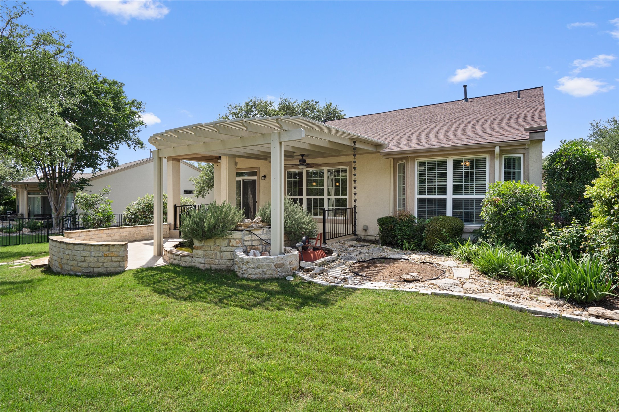 321 Yukon Terrace Georgetown, TX 78633 - Photo 14 of 15 a view of a house with backyard sitting area and garden