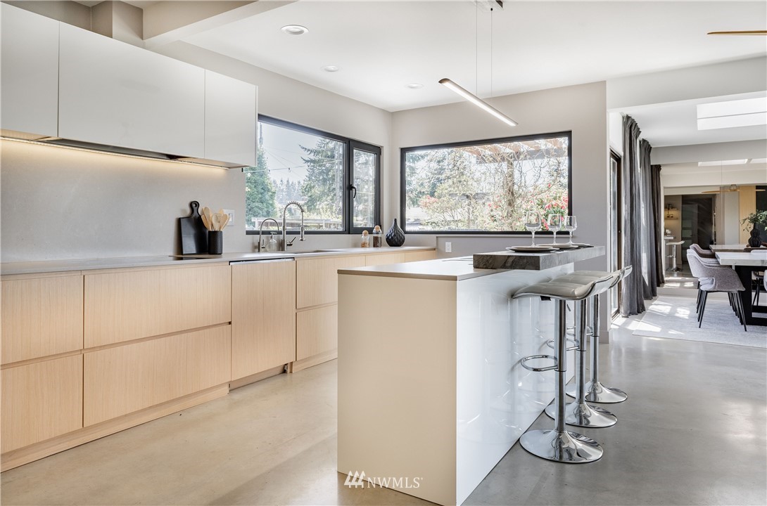 1208 48th Street Southeast Everett, WA 98203 - Photo 12 of 40 a kitchen with stainless steel appliances granite countertop a stove a sink and a refrigerator