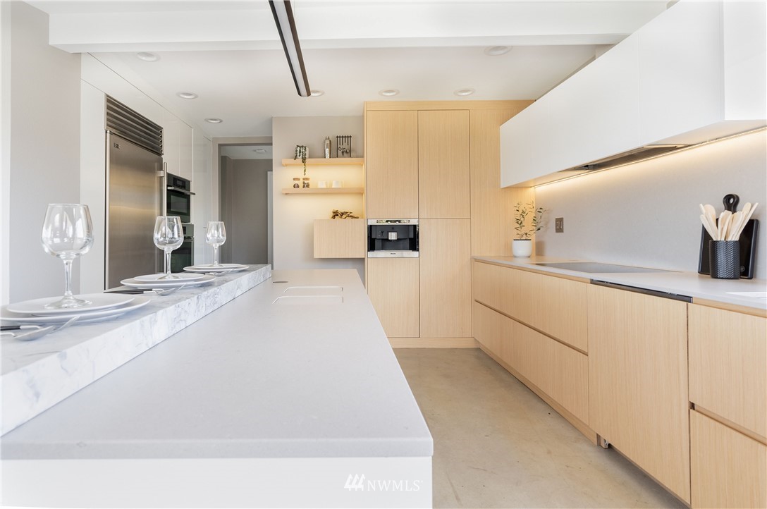 1208 48th Street Southeast Everett, WA 98203 - Photo 13 of 40 a large white kitchen with cabinets