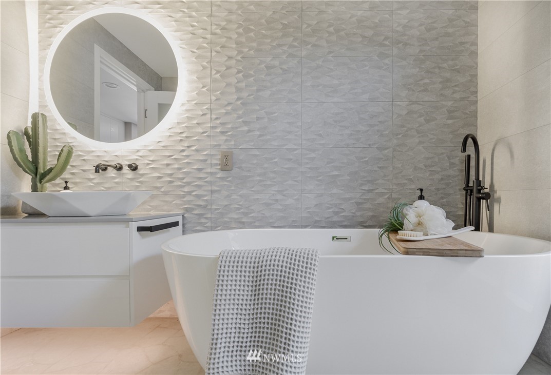 1208 48th Street Southeast Everett, WA 98203 - Photo 29 of 40 a bathroom with a sink and a mirror