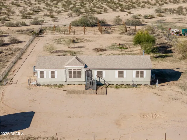 a view of house with yard covered in snow