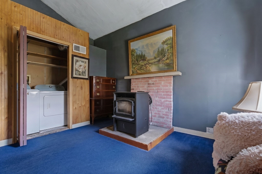 49 Francine Road Raynham, MA 02767 - Photo 20 of 31 a living room with furniture and a fireplace