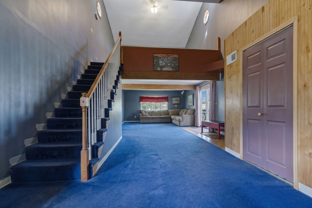 49 Francine Road Raynham, MA 02767 - Photo 21 of 31 a view of a hallway with wooden floor and staircase