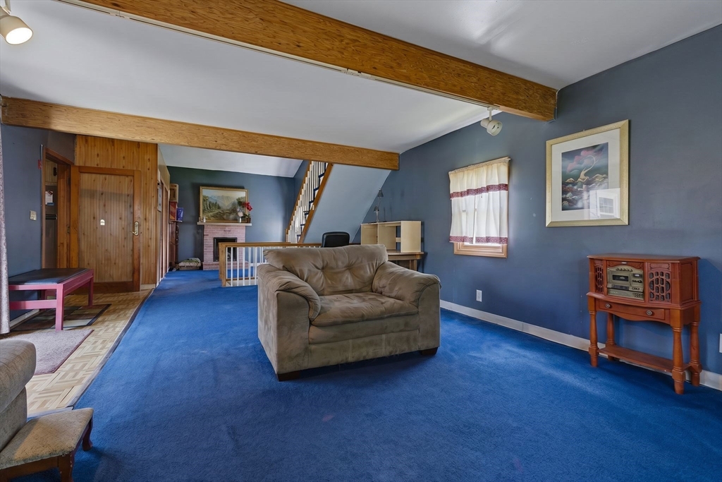 49 Francine Road Raynham, MA 02767 - Photo 23 of 31 a living room with furniture and a wooden floor