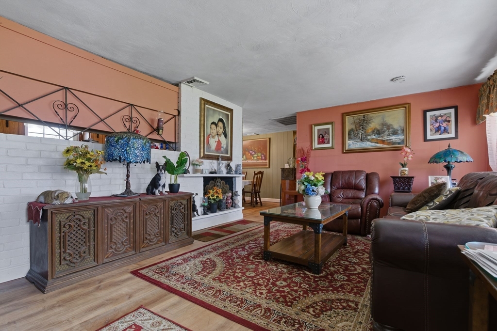 49 Francine Road Raynham, MA 02767 - Photo 6 of 31 a living room with furniture and a fireplace