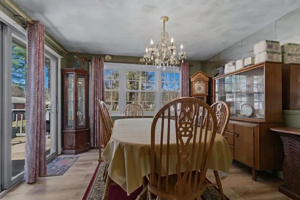 a view of a dining room with furniture chandelier
