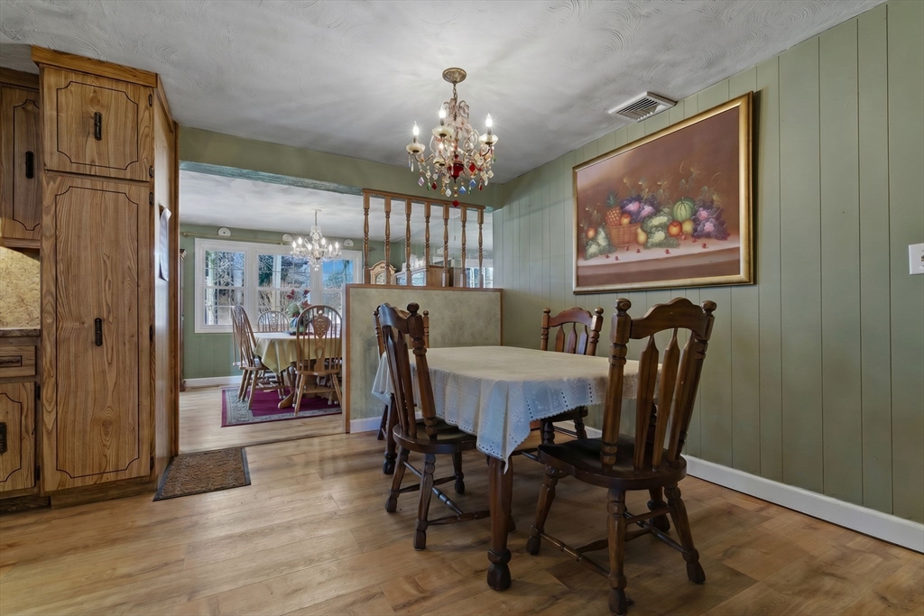49 Francine Road Raynham, MA 02767 - Photo 9 of 31 a view of a dining room with furniture window and wooden floor
