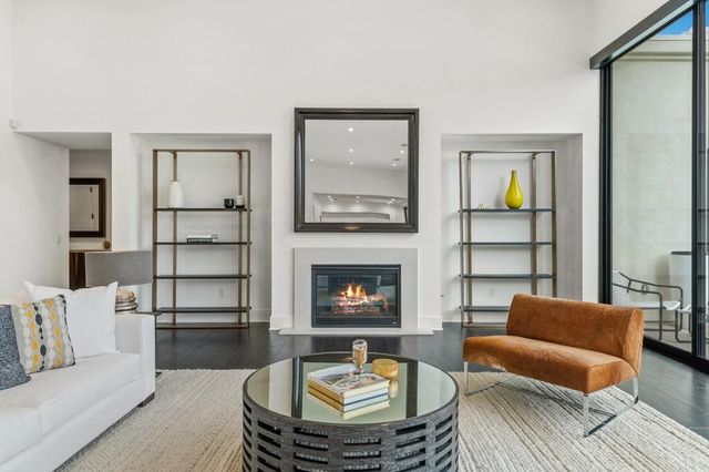 a kitchen that has a table and chairs in it