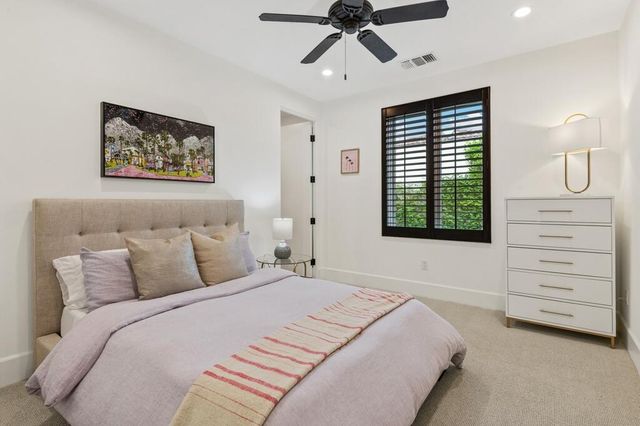 a view of a swimming pool with a lake in the background