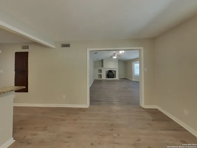 a large kitchen with a stove and a sink