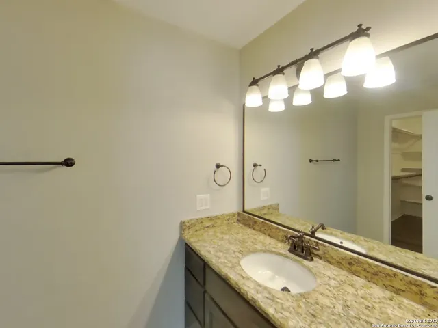 a bathroom with a shower and toilet