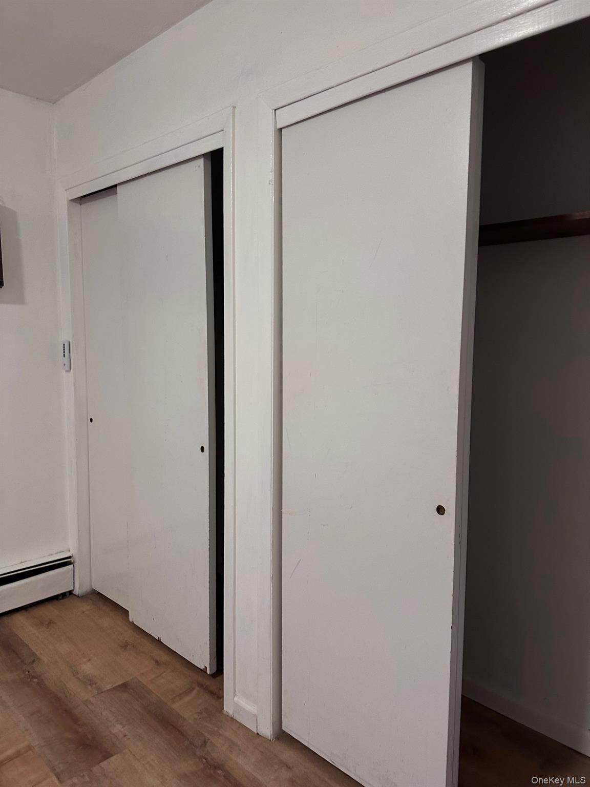 20 Broadway Mastic, NY 11950 - Photo 7 of 11 a view of small space with wooden floor