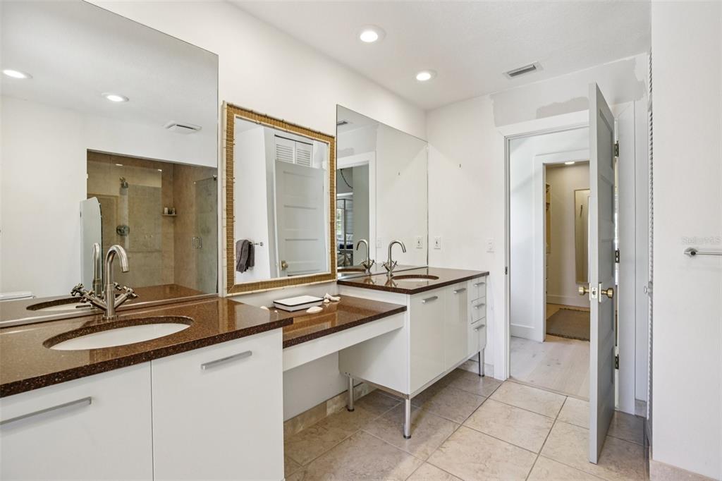 3390 Bayou Sound Longboat Key, FL 34228 - Photo 33 of 59 a bathroom with a sink and a mirror