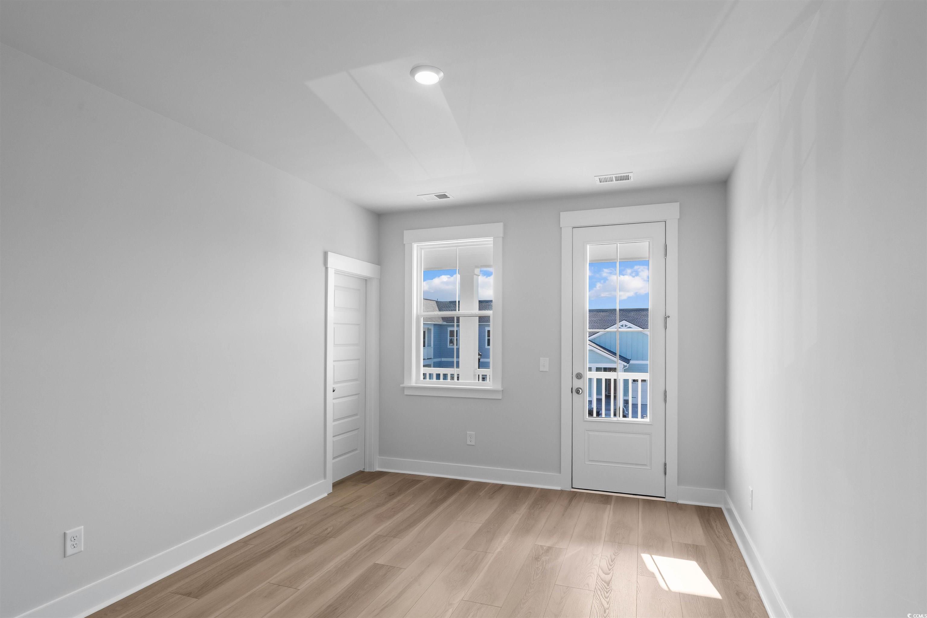 220 Atlantic Breeze Street Myrtle Beach, SC 29572 - Photo 6 of 38 Unfurnished room featuring light wood-type flooring and baseboards