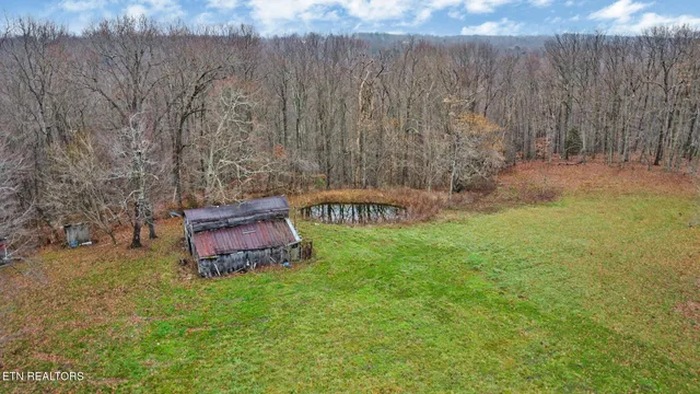 a view of a backyard with a barn