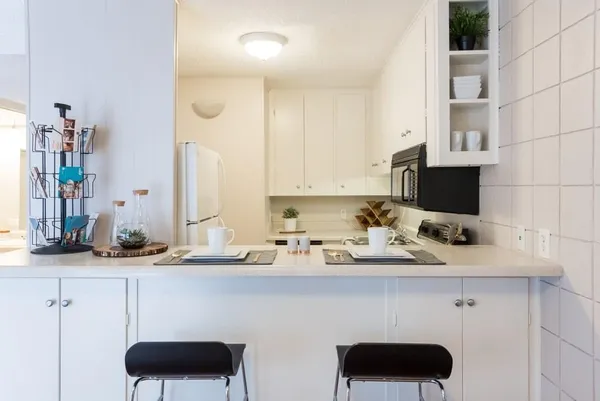 a kitchen with a sink and cabinets