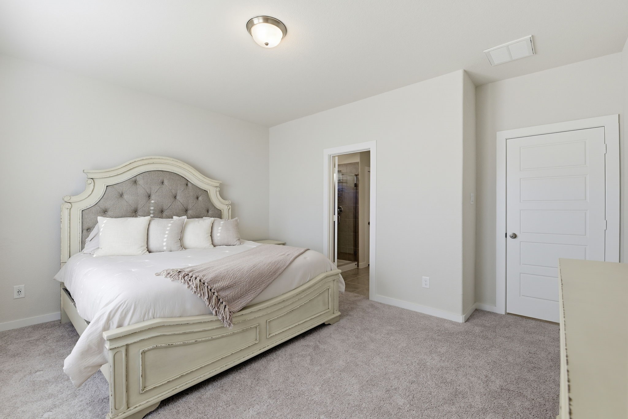 18623 Frost Ridge Drive Crosby, TX 77532 - Photo 21 of 40 a bedroom with a bed and a night stand