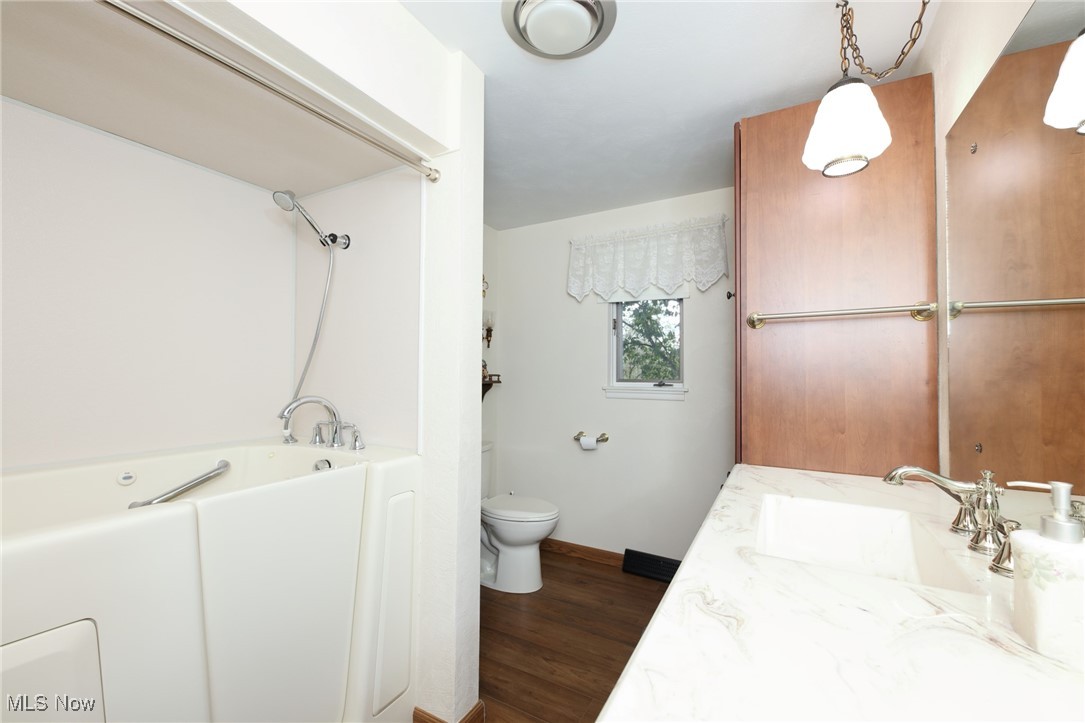 115 Carol Road Wellsburg, WV 26070 - Photo 28 of 36 Bathroom featuring vanity and dark wood-type flooring