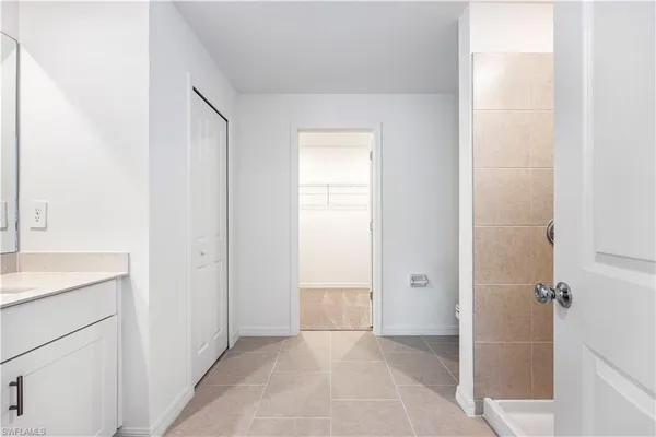 a bathroom with a bathtub and shower