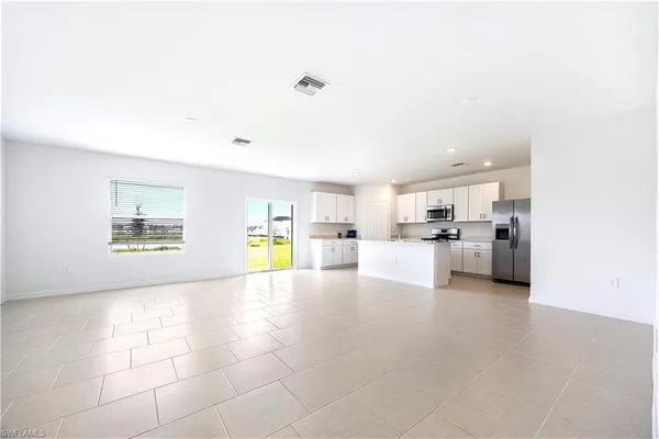 a view of a kitchen with furniture and a kitchen