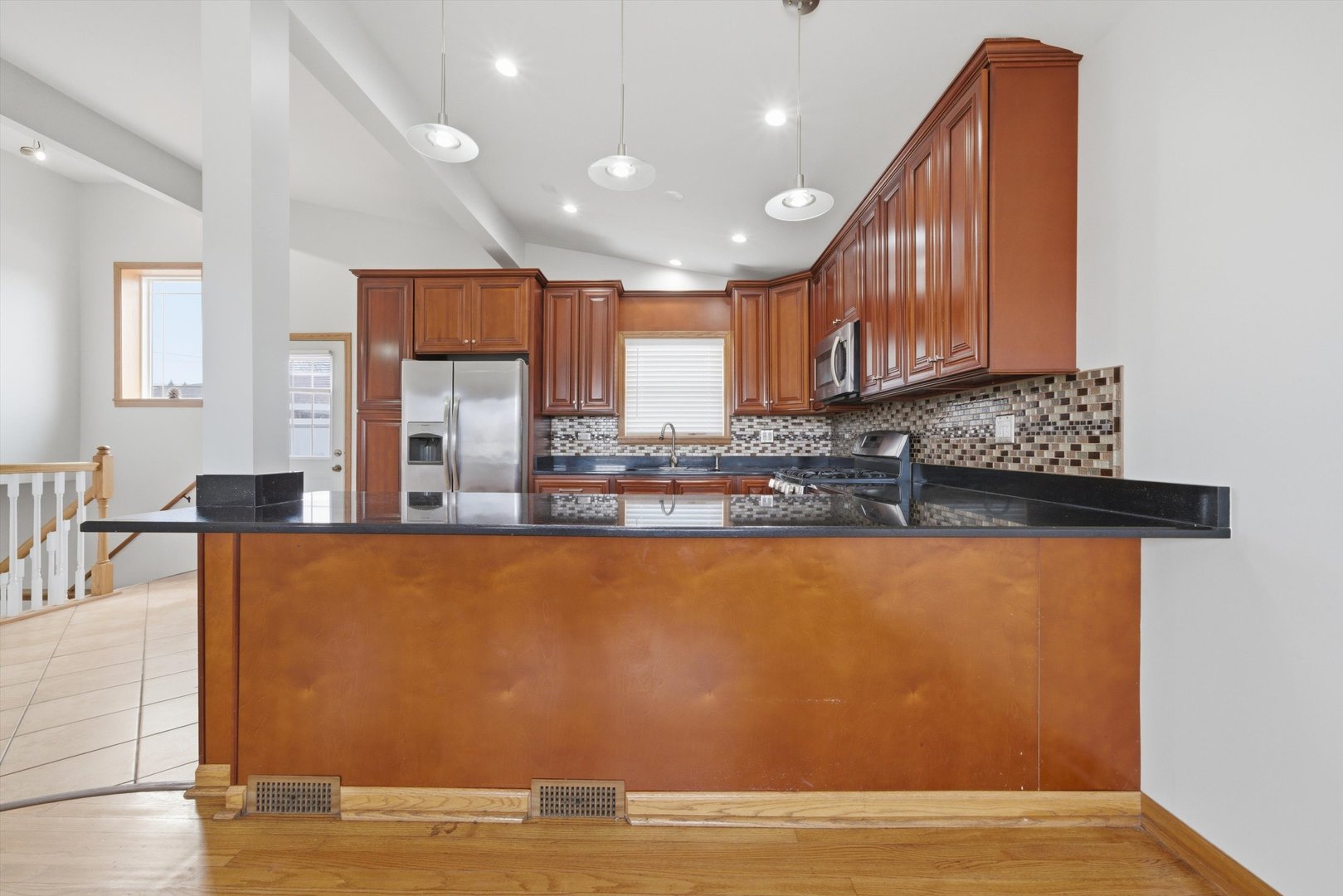 10725 Rutherford Avenue Worth, IL 60482 - Photo 16 of 44 a view of kitchen with stainless steel appliances granite countertop a stove a sink and a refrigerator