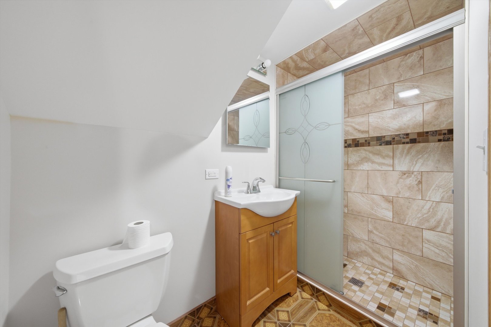 10725 Rutherford Avenue Worth, IL 60482 - Photo 19 of 44 a bathroom with a sink a toilet and shower