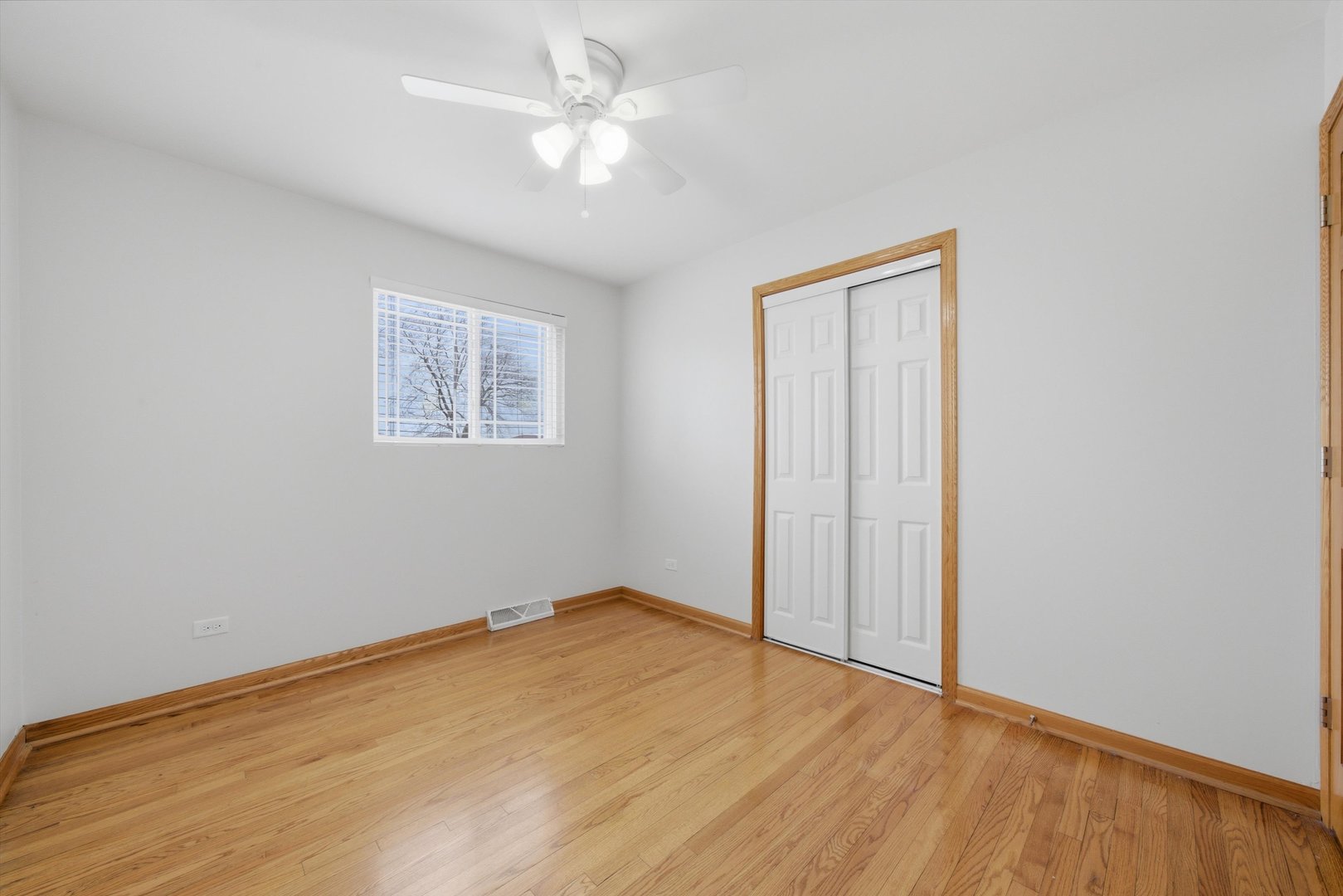 10725 Rutherford Avenue Worth, IL 60482 - Photo 21 of 44 a view of an empty room with wooden floor