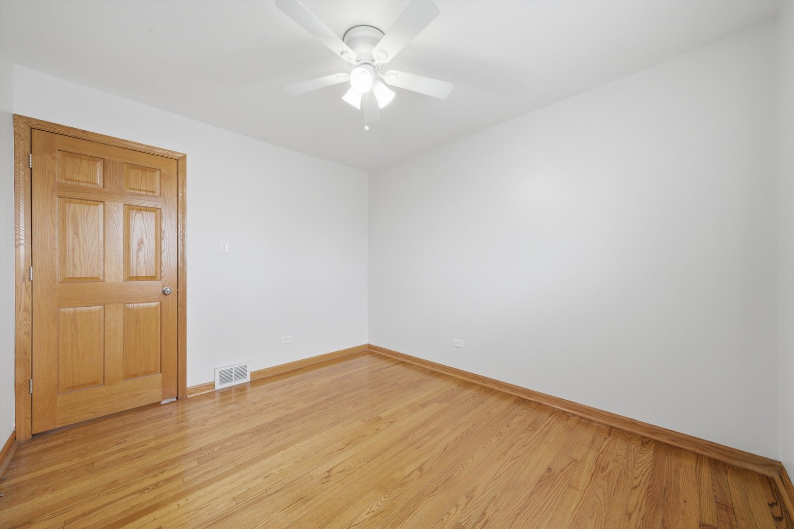 10725 Rutherford Avenue Worth, IL 60482 - Photo 23 of 44 wooden floor in an empty room
