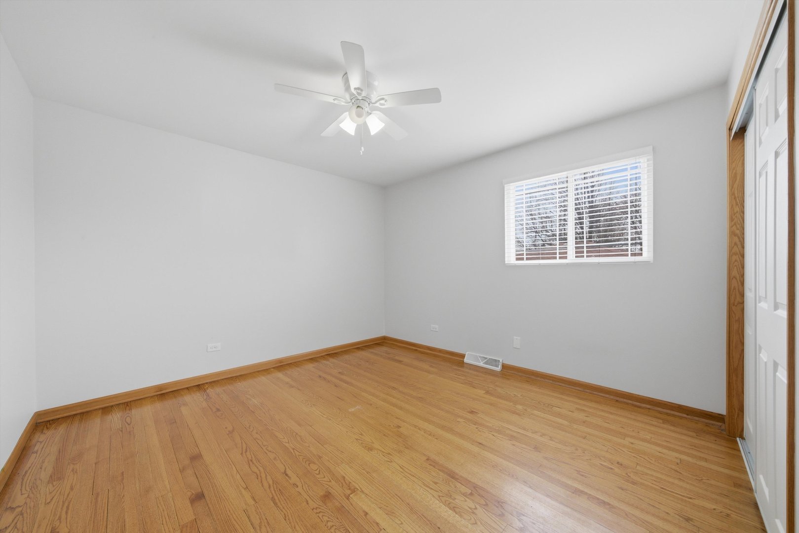 10725 Rutherford Avenue Worth, IL 60482 - Photo 28 of 44 wooden floor in an empty room with a window