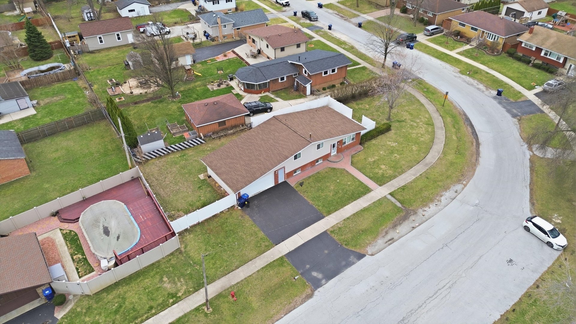 10725 Rutherford Avenue Worth, IL 60482 - Photo 39 of 44 an aerial view of a house with a swimming pool yard and outdoor seating