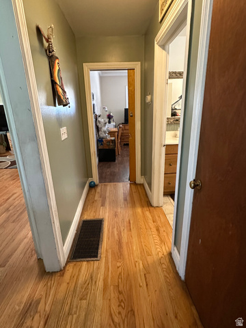 8320 West 3100th Street South Magna, UT 84044 - Photo 17 of 41 Hall featuring light wood-type flooring and baseboards